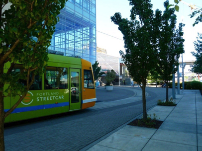 Streetcar behind the OHSU Center for Health & Healing — note Tram station just beyond
